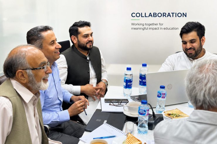 FAME team in discussion around a meeting table
